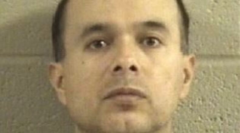 Jesus Sandoval told authorities he was trying to teach the dog to follow the truck. (Credit: Dalton Daily Citizen)