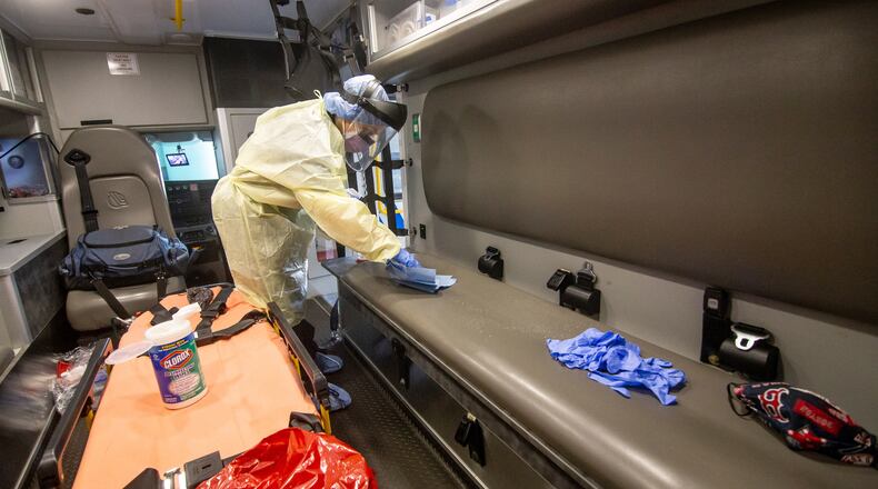 Paramedic Christopher Kozinski demonstrates how the truck would be sanitized after every call at the Central EMS office in Roswell, July 16, 2020. STEVE SCHAEFER FOR THE ATLANTA JOURNAL-CONSTITUTION