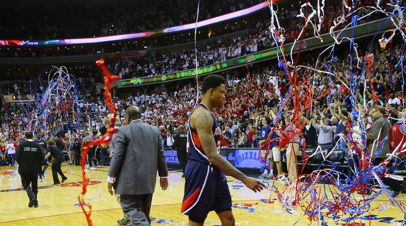 Streamers fall for the Wizards as the Hawks’ Kent Bazemore walks off the court after a 103-101 loss in Game 3 of the Eastern Conference semifinals at the Verizon Center on Saturday. (Curtis Compton/ccompton@ajc.com)
