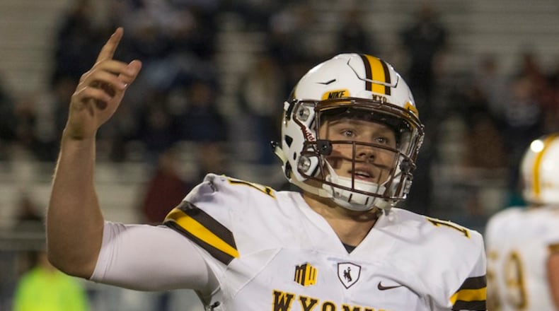 Wyoming quarterback Josh Allen reacts after scoring a touchdown in the second half of an NCAA college football game against Nevada on Saturday, Oct. 22, 2016 in Reno, Nev. (AP Photo/Tom R. Smedes)
