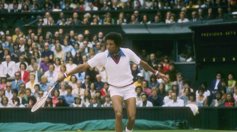 Arthur Ashe runs for the ball during a match at Wimbledon in England. (Tony Duffy/Getty Images)