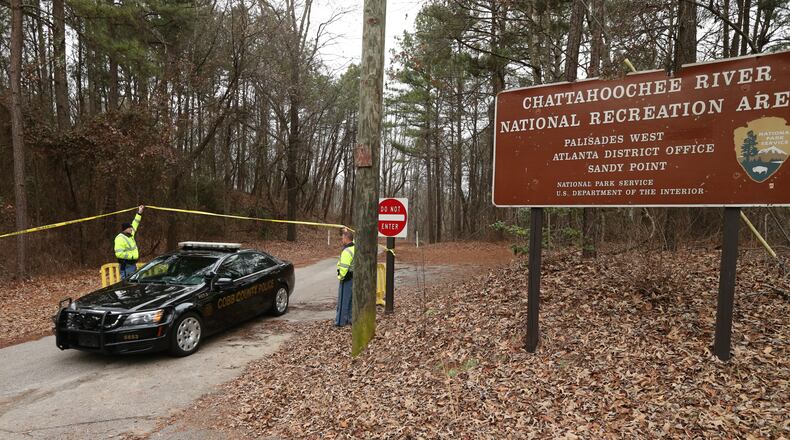 Three suspects in the shooting of a Cobb police officer were detained near this scene Tuesday morning.