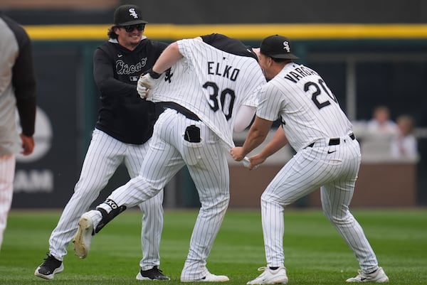 Chicago White Sox's Tim Elko (30), center, is swarmed by his teammates after he hit a walk-off single to defeat the Detroit Tigers in a baseball game Thursday, June 5, 2025, in Chicago. (AP Photo/Erin Hooley)