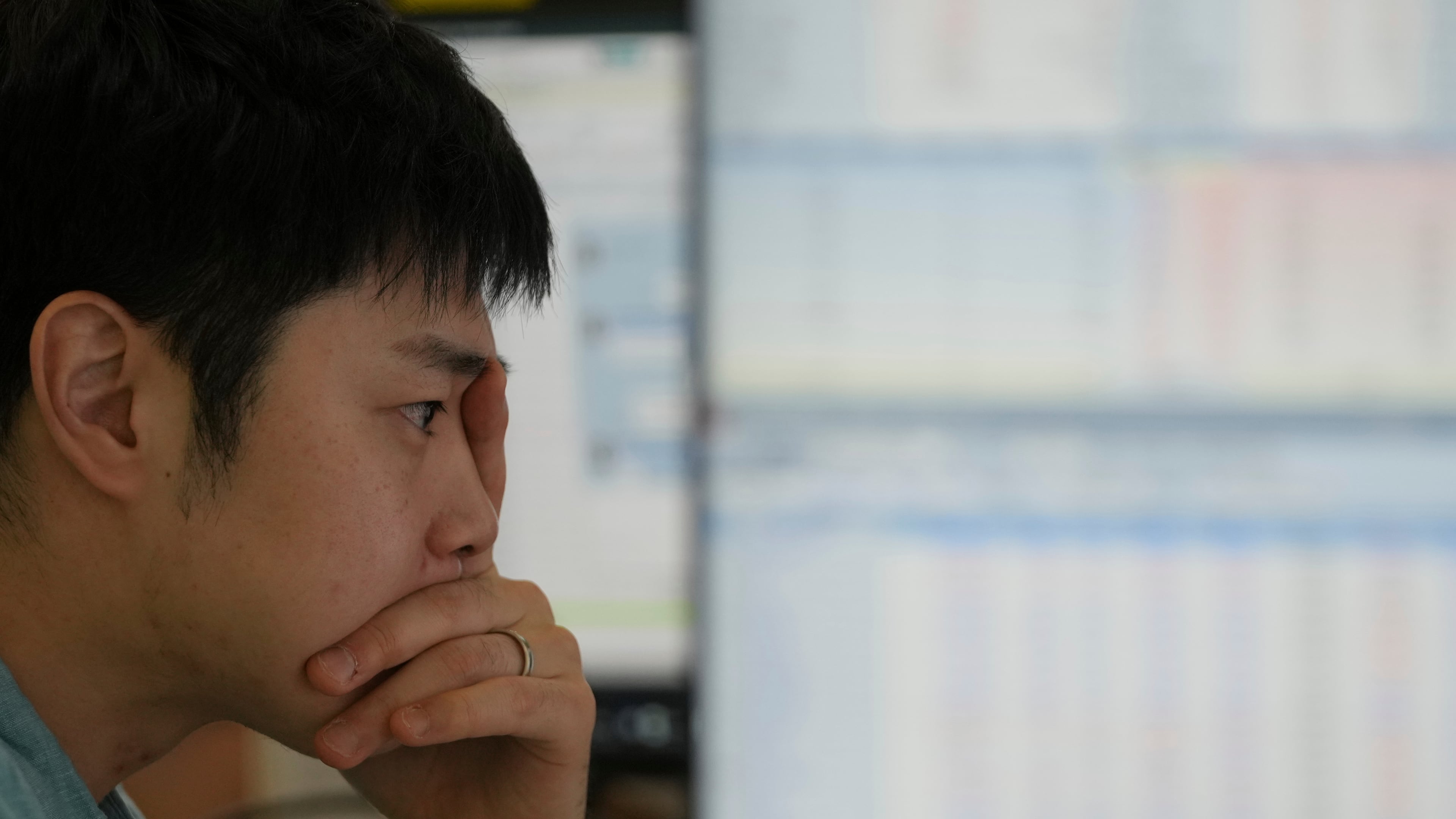 A dealer watches computer monitors at a dealing room of Hana Bank in Seoul, South Korea, Friday, Sept. 12, 2025. (AP Photo/Lee Jin-man)