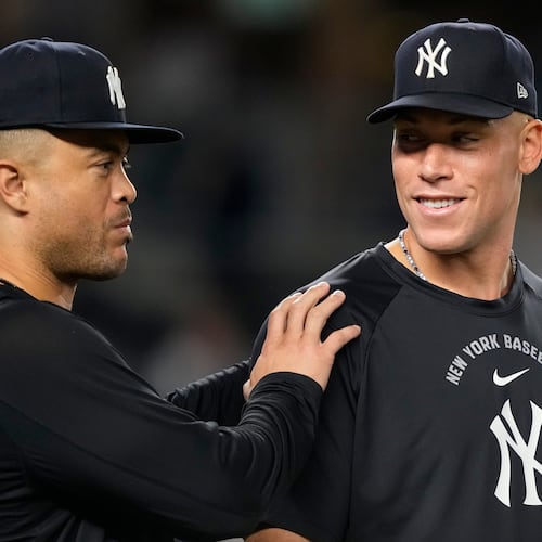 New York Yankees' Aaron Judge, right, and Giancarlo Stanton, left, celebrate after winning a baseball game against the Boston Red Sox, Friday, Aug. 28, 2026, in New York. (AP Photo/Yuki Iwamura)