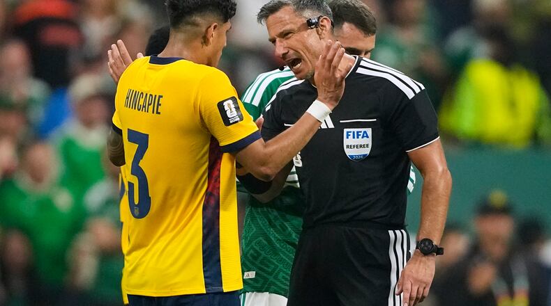 Referee Slavko Vincic of Slovenia speaks to Ecuador's Piero Hincapie (3) before sending him from the field during the World Cup round of 32 soccer match between Mexico and Ecuador in Mexico City, Tuesday, June 30, 2026. (AP Photo/Natacha Pisarenko)
