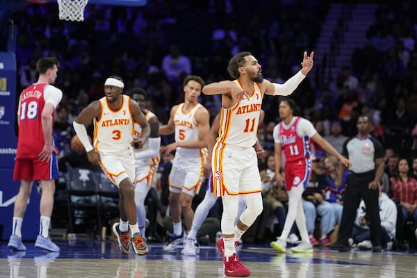 Atlanta Hawks' Trae Young reacts during the second half of an NBA basketball game against the Philadelphia 76ers, Friday, April 11, 2025, in Philadelphia. (AP Photo/Matt Rourke)