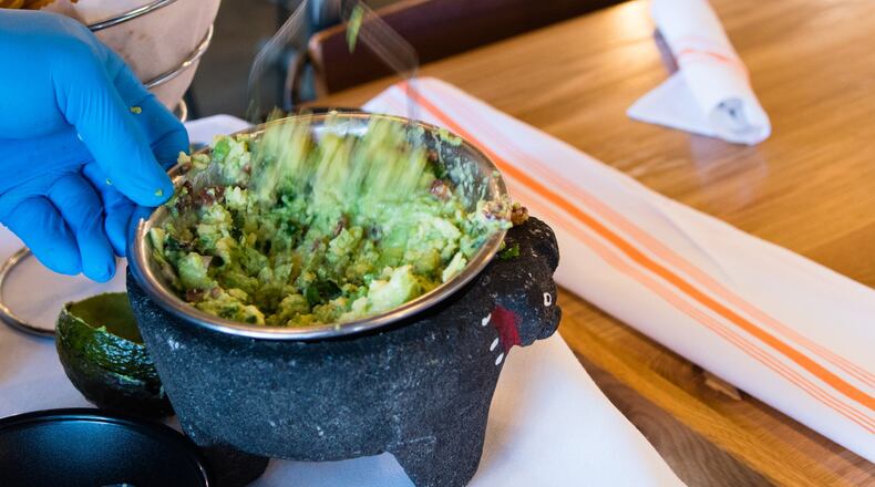 Tableside guacamole is a specialty at Babalu. CONTRIBUTED BY HENRI HOLLIS