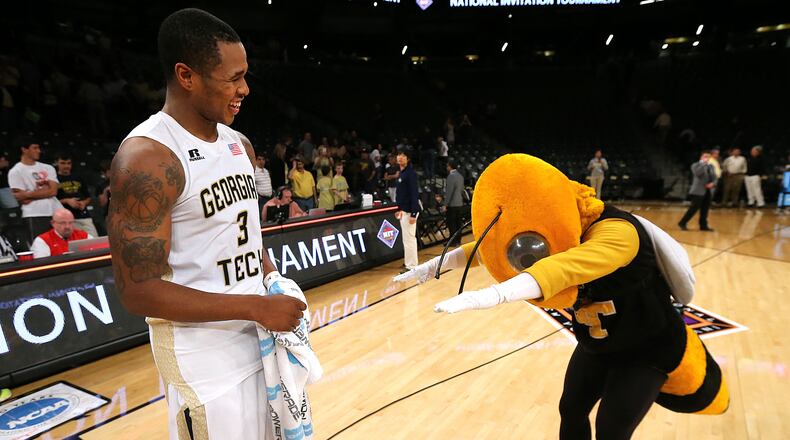 Georgia Tech mascot Buzz bows to guard Marcus Georges-Hunt after he led his team to a 81-62 victory over Houston during their first round NIT basketball game on Wednesday, March 16, 2016, in Atlanta.   Curtis Compton / ccompton@ajc.com