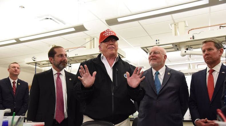 President Donald Trump speaks to the media Friday afternoon at the CDC.