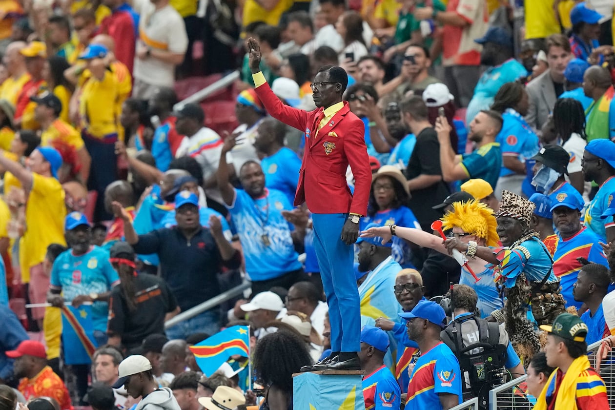 Congo supporter Michel Nkuka Mboladinga poses as a statue of the country's assassinated independence hero Patrice Lumumba ahead of the World Cup match against Colombia in Mexico on Tuesday, June 23, 2026. (Fernando Llano/AP)