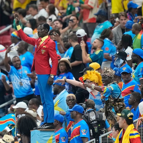 Congo supporter Michel Nkuka Mboladinga poses as a statue of the country's assassinated independence hero Patrice Lumumba ahead of the World Cup match against Colombia in Mexico on Tuesday, June 23, 2026. (Fernando Llano/AP)