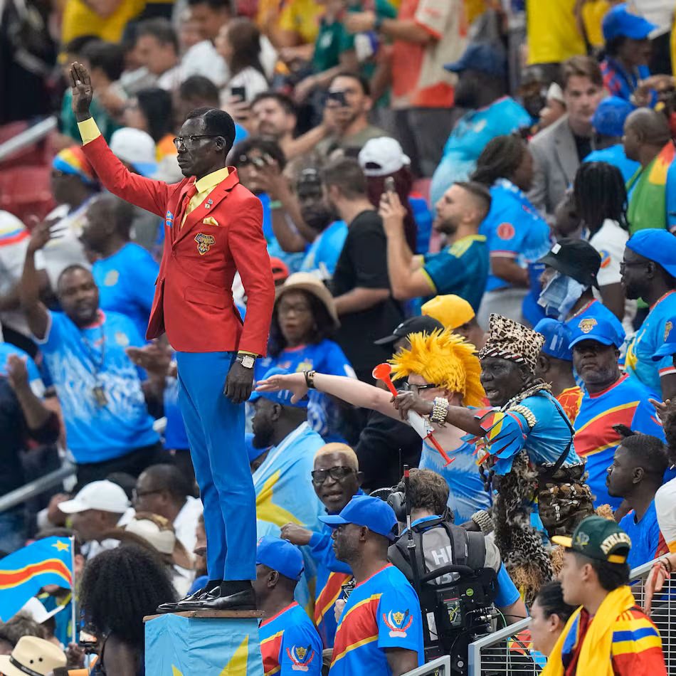 Congo supporter Michel Nkuka Mboladinga poses as a statue of the country's assassinated independence hero Patrice Lumumba ahead of the World Cup match against Colombia in Mexico on Tuesday, June 23, 2026. (Fernando Llano/AP)