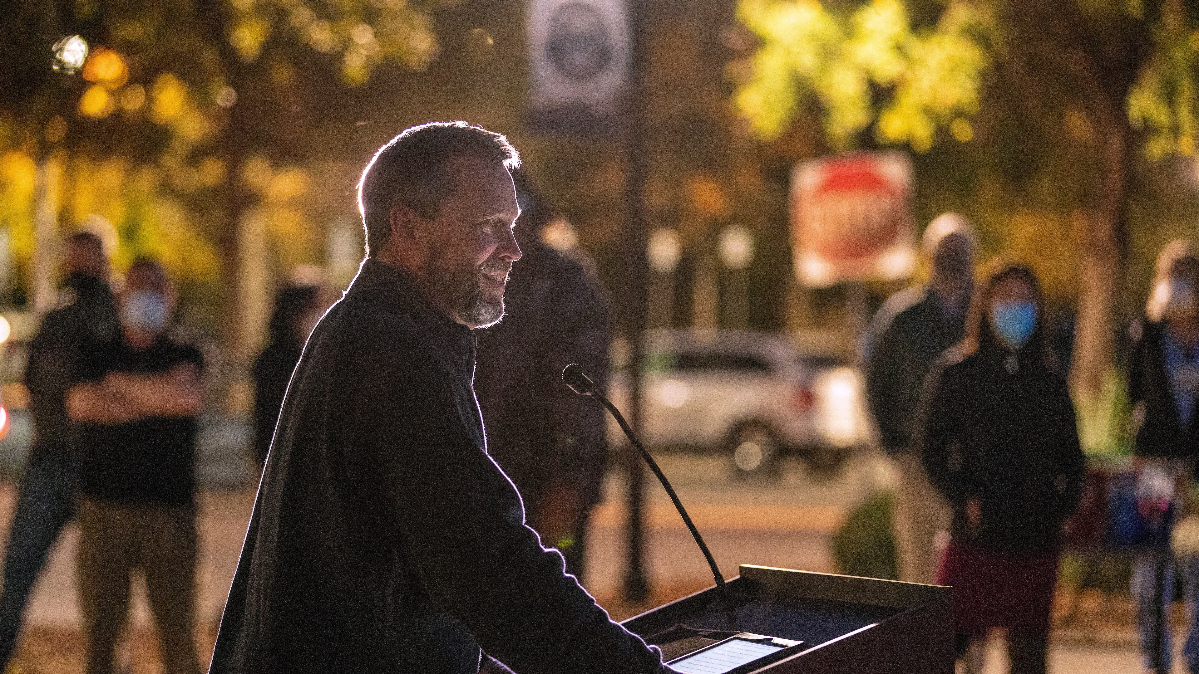 Bishop Steve Wood of St. Andrew's Church thanks health care workers at East Cooper Medical Center, where he was a patient fighting COVID-19 easier in the year, during an evening event to honor health care workers at East Cooper Medical Center Monday, Dec. 14, 2020. (Grace Beahm Alford/The Post And Courier via AP)