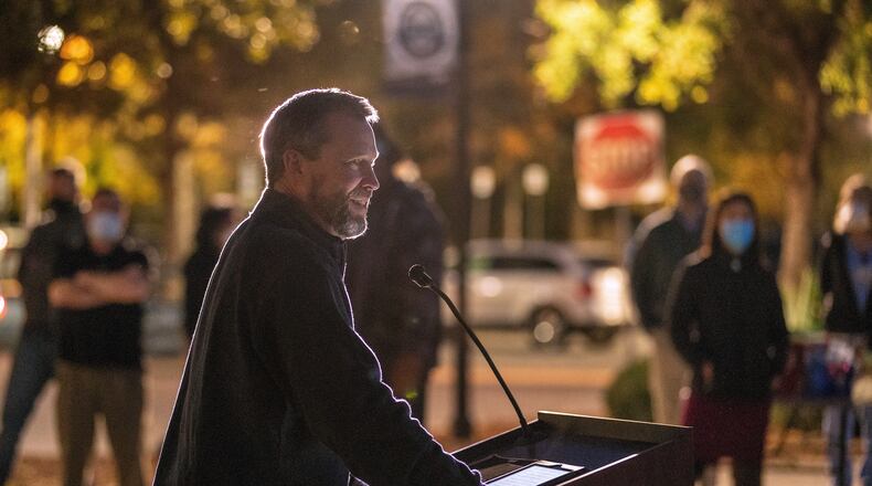 Bishop Steve Wood of St. Andrew's Church thanks health care workers at East Cooper Medical Center, where he was a patient fighting COVID-19 easier in the year, during an evening event to honor health care workers at East Cooper Medical Center Monday, Dec. 14, 2020. (Grace Beahm Alford/The Post And Courier via AP)