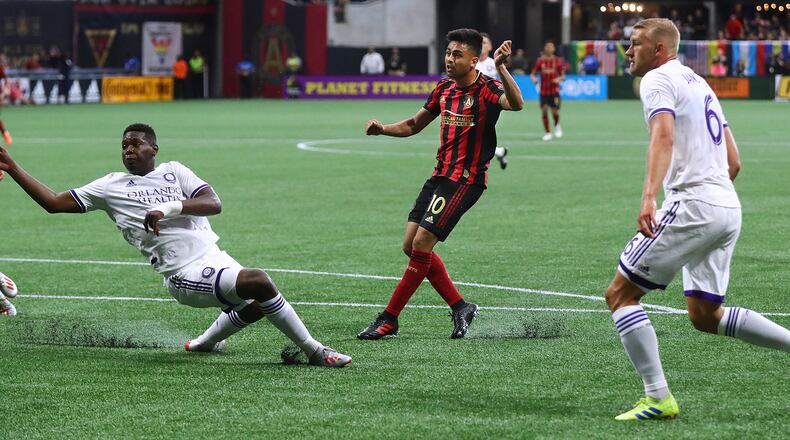 Atlanta United midfielder Pity Martinez scores his first goal of the season past Orlando City defenders in a MLS soccer match on Sunday, May 12, 2019, in Atlanta. Curtis Compton/ccompton@ajc.com