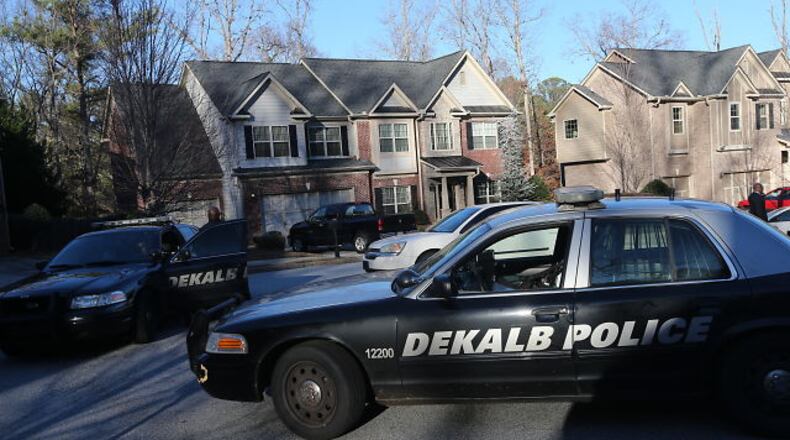DeKalb police at the scene of a shooting that occurred after a home was broken into on Monday, Dec. 16, 2013.