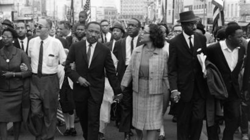 Morton Broffman photographed the Rev. Martin Luther King Jr. and Coretta Scott King leading the 1965 voting rights march into Montgomery. The High Museum liked it so much that it blew up the image and put it on a banner to promote the exhibition.