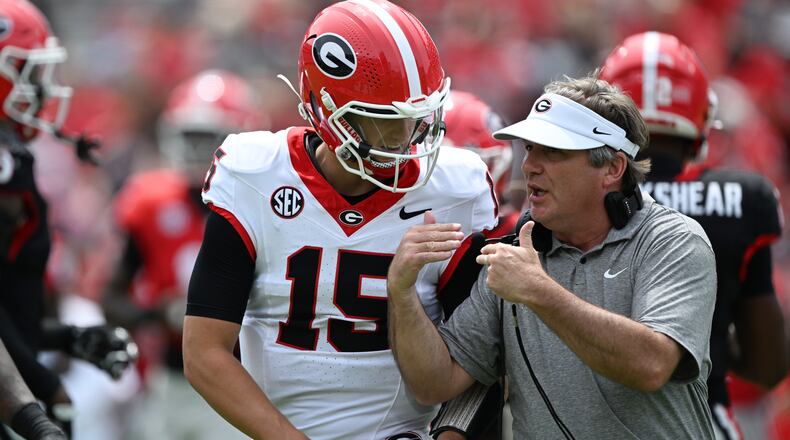 Without the spring transfer portal, Georgia head coach Kirby Smart said, he can focus on his team instead of thinking about who might leave. On G-Day, he instructs QB Ryan Montgomery. (Hyosub Shin/AJC)