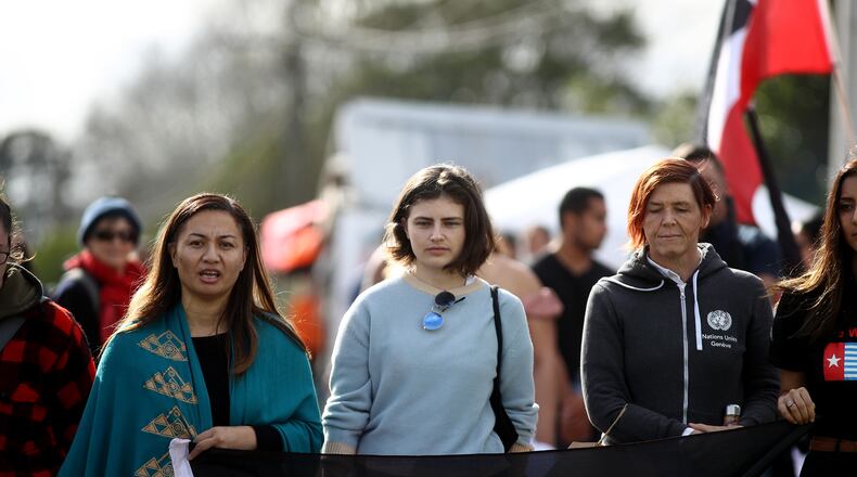 Green Party MP's Chloe Swarbrick , center, delivered a classic millennial response to an older member of the New Zealand Parliament.