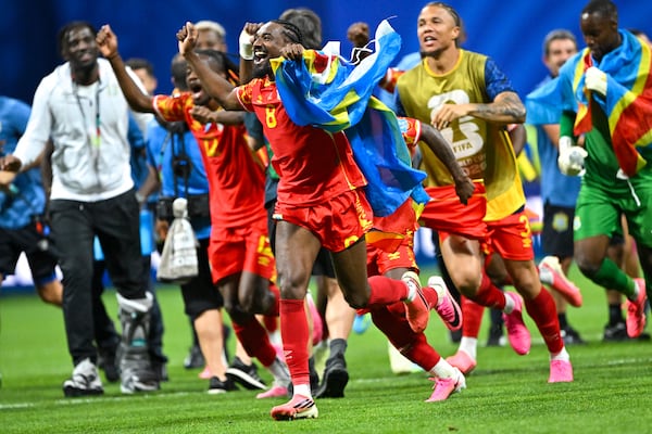 DR Congo midfielder Samuel Moutoussamy (8) celebrates a 3-1 win over Uzbekistan during a FIFA World Cup match at Atlanta Stadium (Mercedes-Benz Stadium) last Saturday. (Hyosub Shin/AJC)