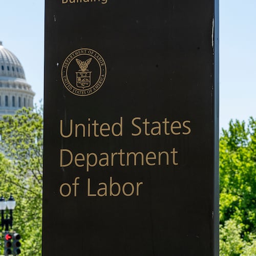 FILE - In this May 7, 2020, file photo, the entrance to the Labor Department is seen near the Capitol in Washington. (AP Photo/J. Scott Applewhite, File)