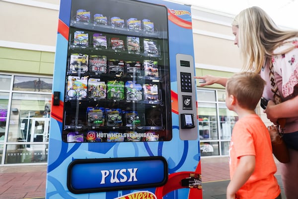 Hot Wheels vending machine owner Kristen Albert said she knew kids would enjoy the machines, but was surprised to see how passionate adults are, as well. (Abbey Cutrer/AJC)