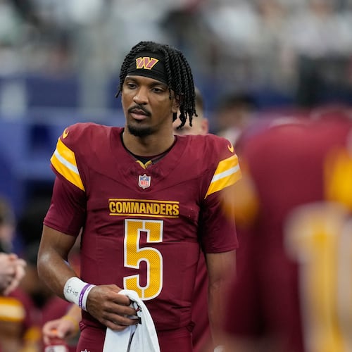 Washington Commanders quarterback Jayden Daniels walks on the sideline during the first half of an NFL football game against the Dallas Cowboys Sunday, Oct. 19, 2025, in Arlington, Texas. (AP Photo/Tony Gutierrez)