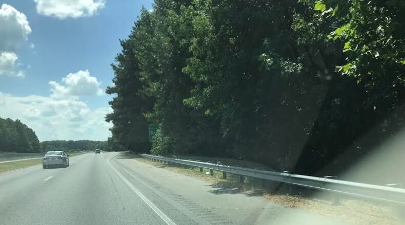 DOT tells us this sign should soon be more visible on I-575. (Photo/Howard Cox)