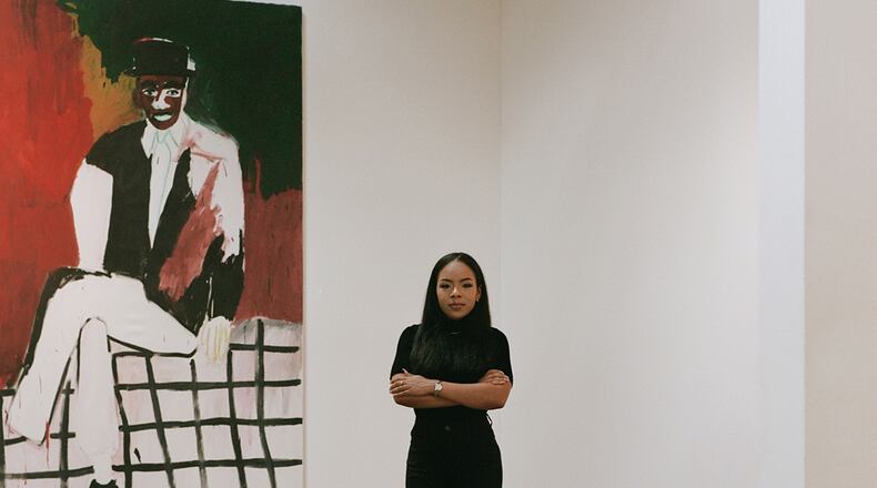 Atlanta Art Week creator Kendra Walker with "Still Untitled" by Patrick Eugene.
(Courtesy of Courtesy of Atlanta Art Week/Piera Moore)