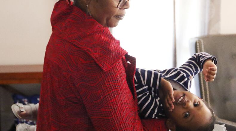 Wanda Irving holds her granddaughter Soleil Irving, 2, in their home in Sandy Springs. Wanda Irving is raising Soleil, whose mom, Dr. Shalon Irving, died in 2017 shortly after giving birth. (PHOTO by EMILY HANEY / emily.haney@ajc.com)