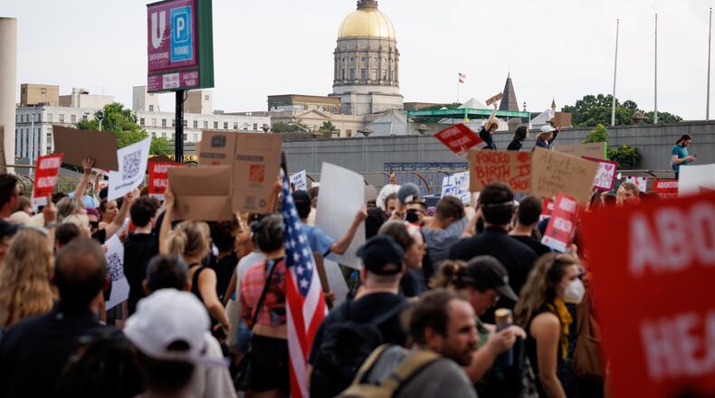 Abortion rights activists marched from the Georgia Capitol to Underground Atlanta on Friday, June 24, 2022. The protest follows the Supreme Court’s overturning of Roe v Wade. (Arvin Temkar / arvin.temkar@ajc.com)
