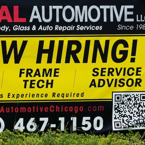 FILE - A now hiring sign is seen in front of an auto body shop in Chicago, June 25, 2026. (AP Photo/Nam Y. Huh, file)