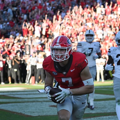 Georgia tight end Lawson Luckie (7) scores a touchdown during the first half in an NCAA football game at Sanford Stadium, Saturday, October 12, 2024, in Athens. (Hyosub Shin/AJC)