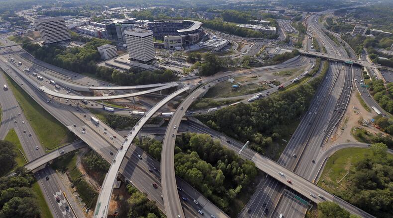 April 14, 2017 — Metro Atlanta pregame traffic looking northwest toward the SunTrust Park stadium. I-285 is to the left and I-75 is to the right. BOB ANDRES /BANDRES@AJC.COM