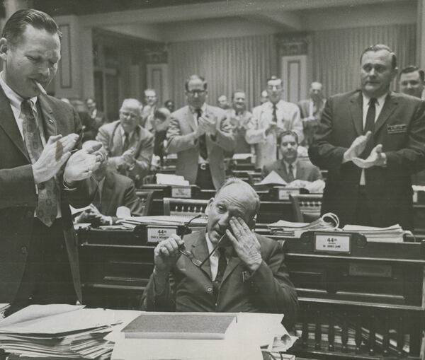 Tom Murphy wipes a tear from his eye during a standing ovation which commended his work as administration floor leader during the session of the Georgia Legislature in 1969 (AP) 
