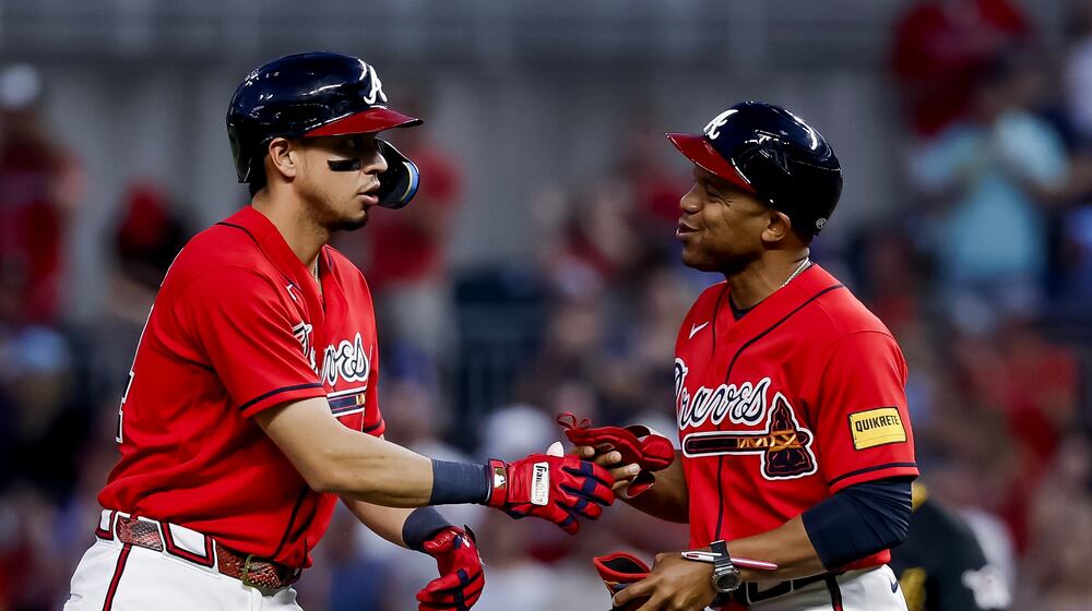 Braves utilityman Mauricio Dubón (left) celebrates with first base coach Antoan Richardson after hitting an RBI double against the Pirates on Friday, June 5, 2026, in Atlanta. Dubón has played in 60 of the team’s first 64 games. (Erik S. Lesser/AP)