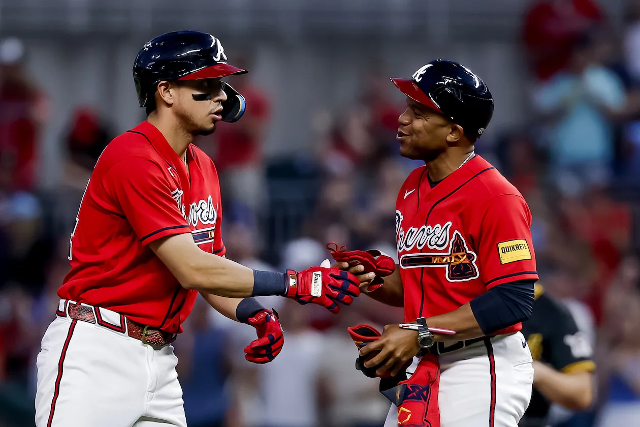 Atlanta Braves' Mauricio Dubon, left, reacts with first base coach Antoan Richardson, right, after hitting an RBI double against the Pittsburgh Pirates during the fifth inning of a baseball game, Friday, June 5, 2026, in Atlanta. (Erik S. Lesser/AP)
