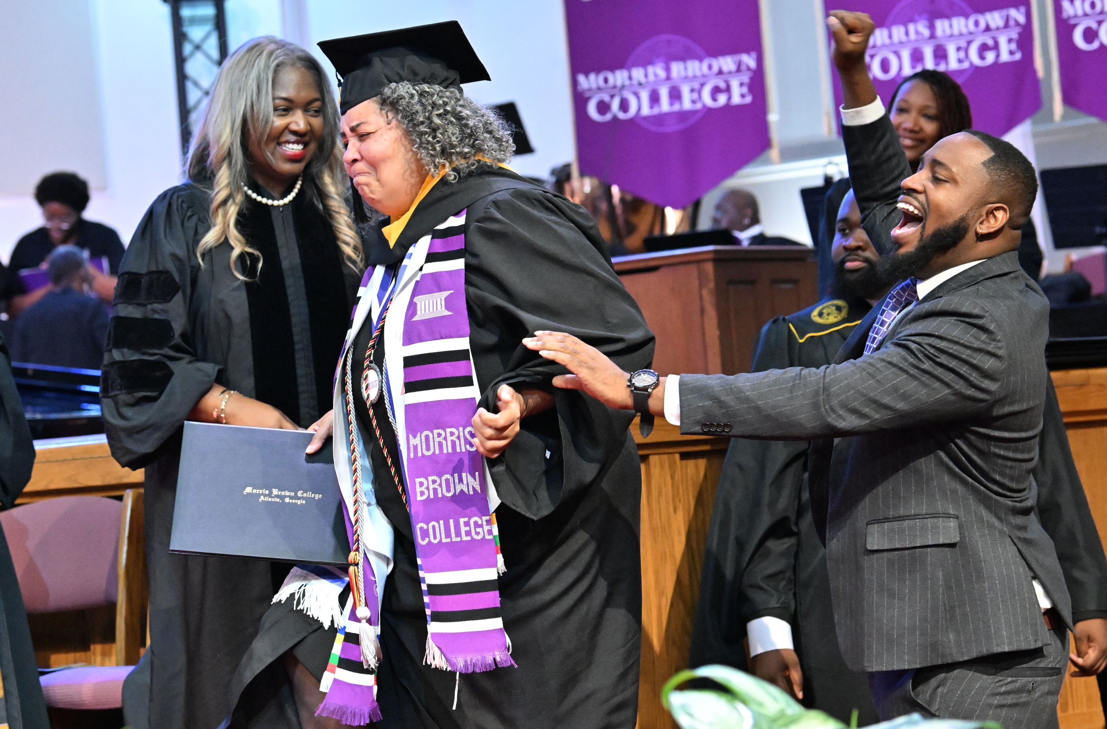 Artrisia Edwards reacts before she receives her degree during the 2025 Morris Brown College commencement exercises at Saint Philip A.M.E. Church, Saturday, May 17, 2025, in Atlanta. (Hyosub Shin / AJC)