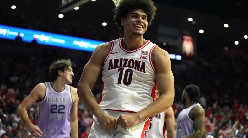 Arizona forward Koa Peat reacts after scoring against Kansas State during the second half of an NCAA college basketball game, Wednesday, Jan. 7, 2026, in Tucson, Ariz. (AP Photo/Rick Scuteri)