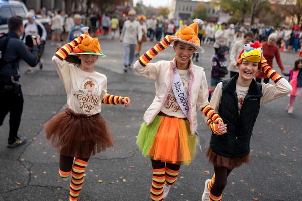 Many runners wore festive costumes for the 2024 Gobble Jog in downtown Marietta on Thursday, Nov. 28, 2024. (Ben Hendren for the AJC)