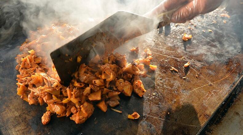 La Jacka Mobile food truck owner/cook Miriam Martinez cooks chopped, unripe jackfruit on the grill to make meatless dishes on January 6, 2017, in Fresno, Calif. (Silvia Flores/Fresno Bee/TNS)