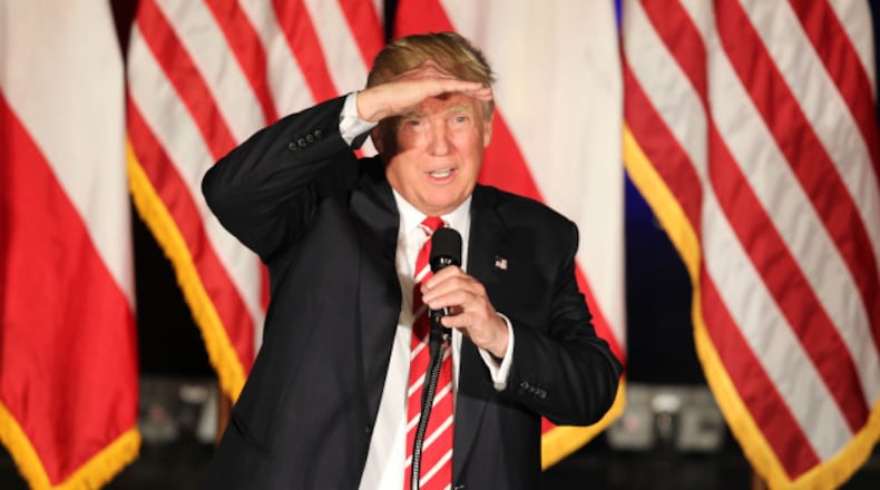 Donald Trump speaking at the Fox Theater last June. Limiting immigration was a key theme during his campaign. 
EMILY JENKINS/ EJENKINS@AJC.COM