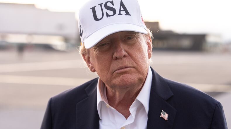 President Donald Trump speaks with reporters before boarding Air Force One at Shannon Airport, Sunday, Sept. 13, 2026, in Shannon, Ireland. (AP Photo/Julia Demaree Nikhinson)