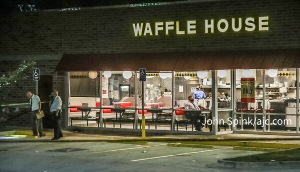 An argument at a DeKalb County Waffle House led to a triple shooting, authorities said.