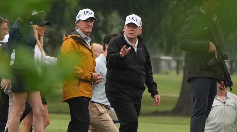 FILE - President Donald Trump, right, and Interior Secretary Doug Burgum tour the East Potomac Park golf course, June 28, 2026, in Washington. (AP Photo/Mark Schiefelbein, File)