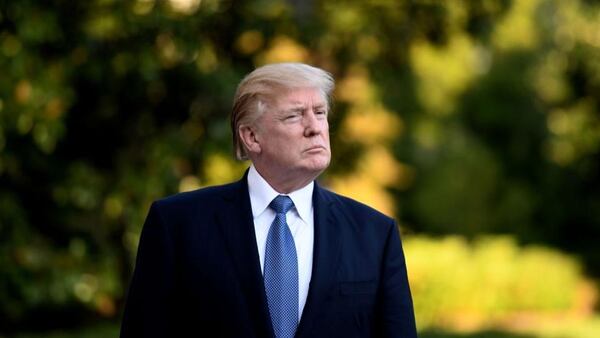WASHINGTON, DC - SEPTEMBER 24: (AFP OUT) U.S. President Donald Trump walks toward the White House after stepping off Marine One on the South Lawn on September 24, 2017 in Washington, DC. (Photo by Olivier Douliery - Pool/Getty Images)
