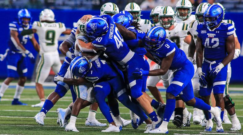 Jordan Veneziale (No. 40) leads the gang tackle against the Charlotte ball carrier in Georgia State's 20-9 win on Sept. 17, 2021.
