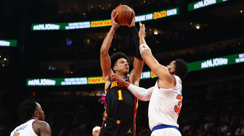 Atlanta Hawks forward Jalen Johnson looks to shoot against New York Knicks center Karl-Anthony Towns, right, during the first half of an NBA basketball game, Monday, April 6, 2026, in Atlanta. (Colin Hubbard/AP)
