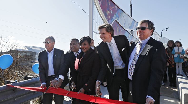 November 25, 2019 - Atlanta - Ed McBrayer (from left), Executive Director of the PATH Foundation, Michael Julian Bond, Atlanta Council member, Keisha Lance Bottoms, Atlanta Mayor, Beau Allen, grandson of Ivan Allen Jr., and Jim Kennedy, Chairman, Cox Enterprises, dedicate the bridge. The PATH Foundation dedicated a bridge to former Atlanta Mayor Ivan Allen Jr. The Ivan Allen Gateway creates a trail connection from Centennial Park to the westside, and serves as a memorial to Mayor Ivan Allen Jr., Atlanta’s mayor from 1962-1970. Bob Andres / robert.andres@ajc.com